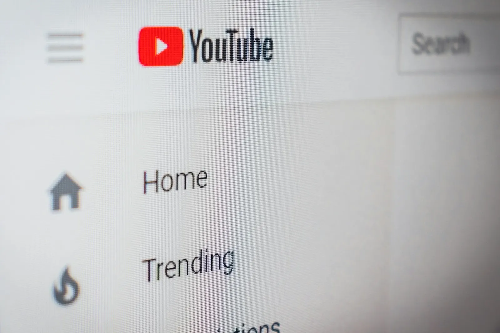 Close-up of the YouTube website menu on a screen